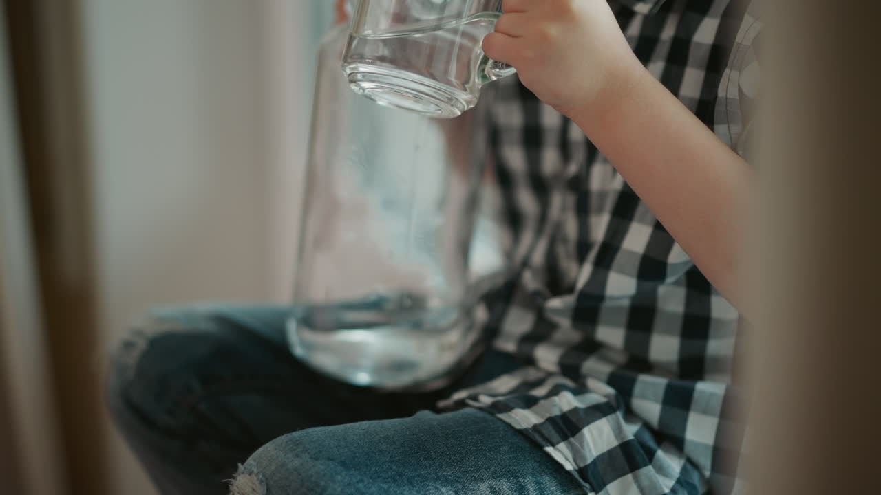 Child Pouring Water