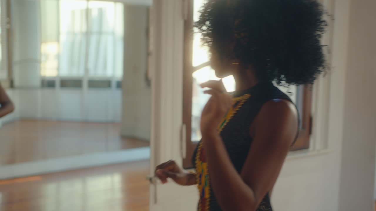 Inspired African-American Female Dancer Practicing Tango in Studio