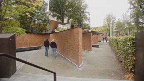 contemplative walk through a modern brick and mirror memorial