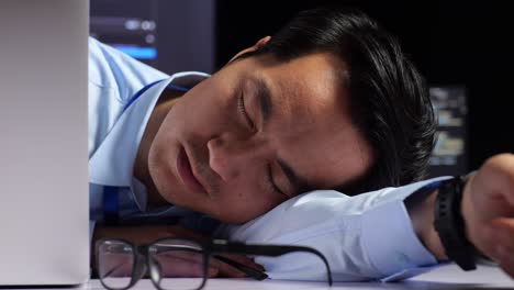 tired worker sleeping at his desk