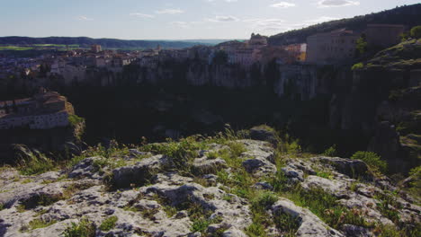 hanging houses at the clifftop from the viewpoint of cerro del socorro hill in cuenca, spain