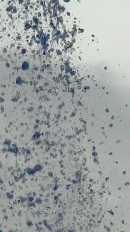 water droplets. streams of fountain close-up. slow motion vertical video