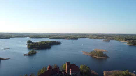 Shot-from-high-in-the-sky-of-medieval-castle-standing-in-the-lake-island