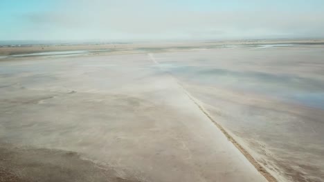 descending through the mist over lake tyrell, in north-west victoria, may 2021