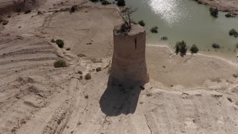 ancient tower in a dried-up lake bed