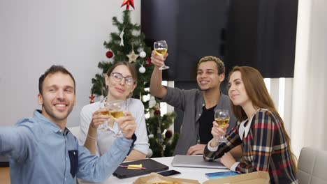 business people drinking toasting with champagne and taking selfie photo at office