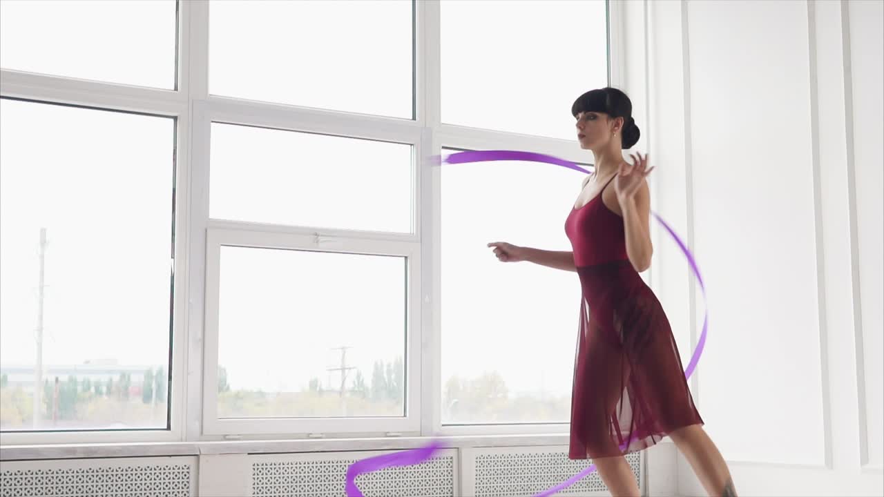 Woman Performing Ribbon Dance in a Studio