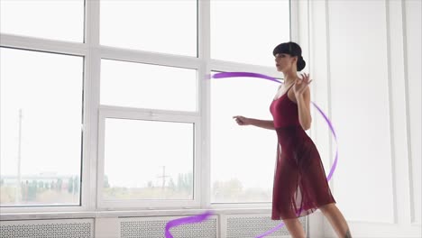 woman performing ribbon dance in a studio