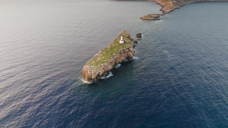 Aerial-view-of-Punta-de-El-Toro-rock-formation-in-turquoise-water,-Mallorca