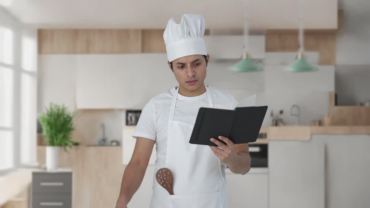 confundido chef profesional indio haciendo comida