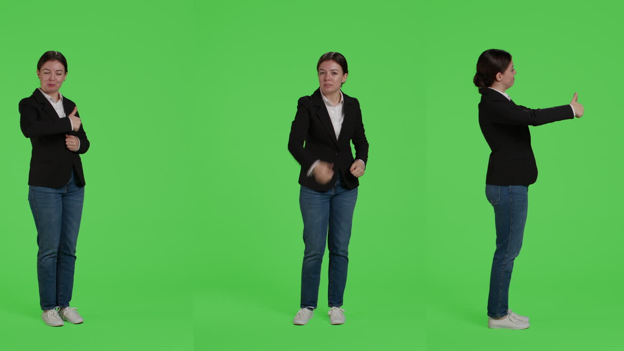 Business woman giving thumbs up on green screen