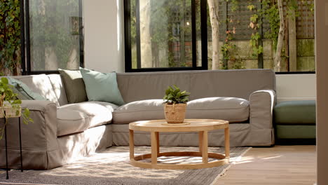 modern living room with cozy sectional sofa and coffee table, bright natural light, copy space