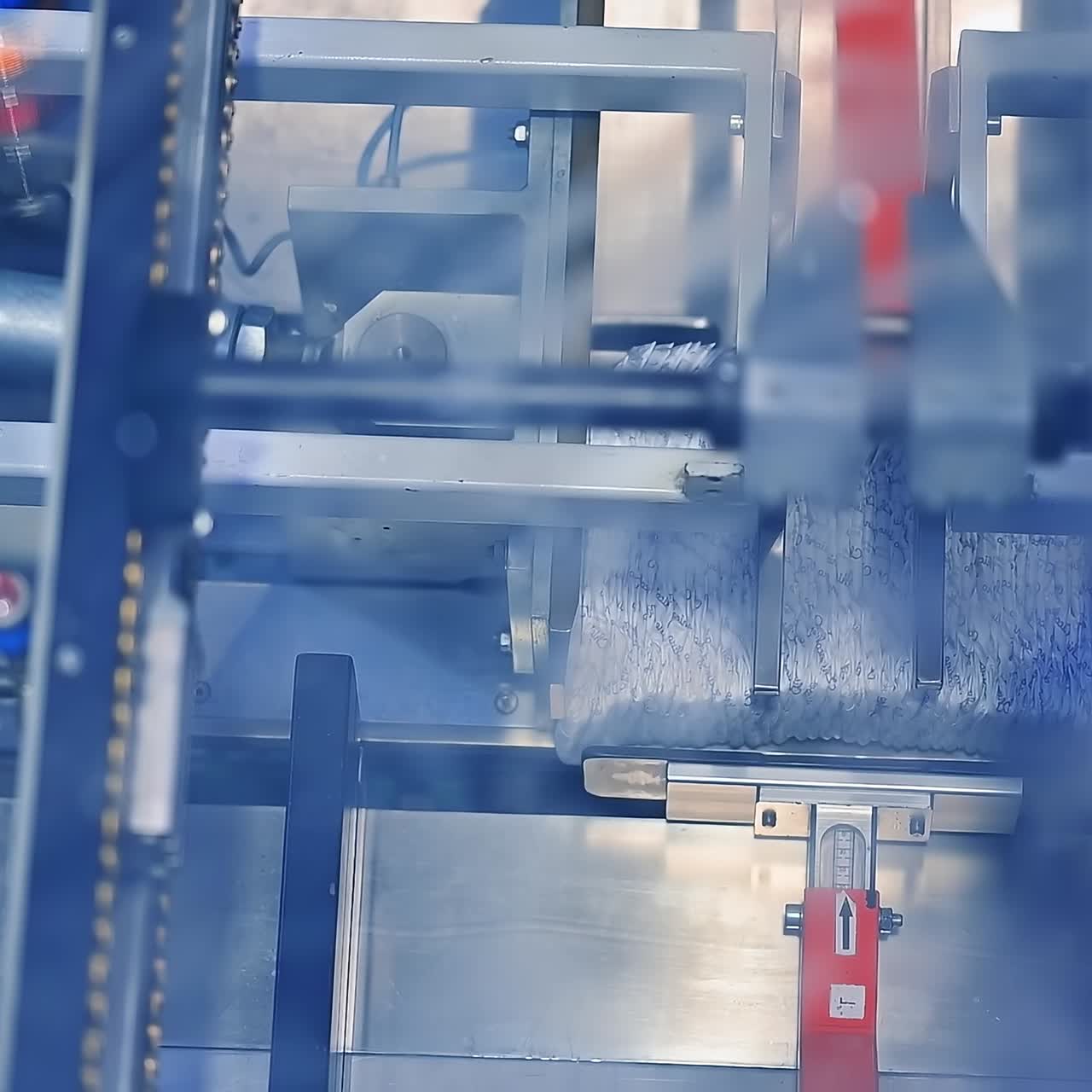 Mechanism for the formation of diaper pack. The final stages of diaper manufacturing at the factory. View from above