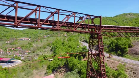 Drone-shot-of-an-emergency-stretcher-transported-on-a-metal-structure