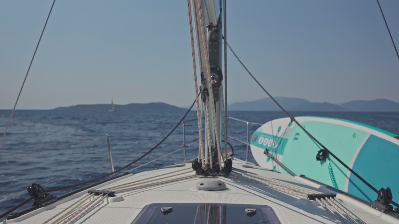 view from a yacht of a greek island at sunrise