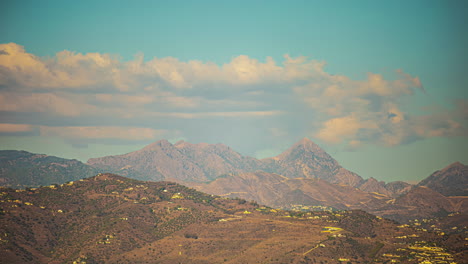 timelapse: rolling clouds over hills and mountains