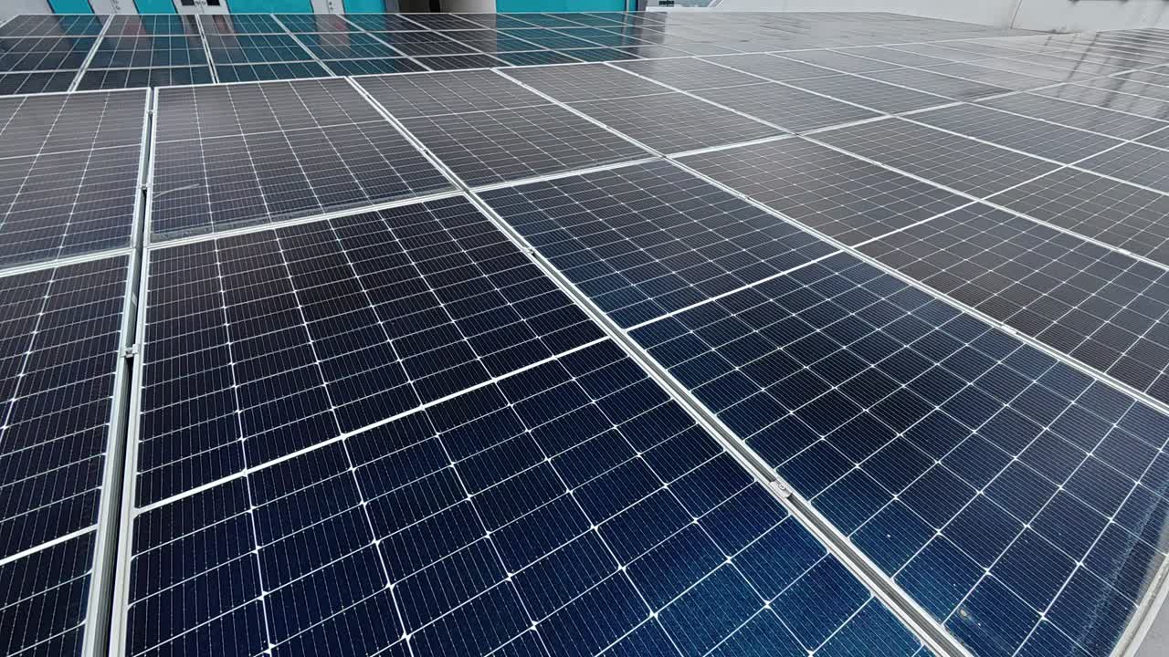 Rows of solar panels installed on a rooftop absorb sunlight, converting it into clean electricity. This sustainable energy source promotes environmental efficiency and supports green living.