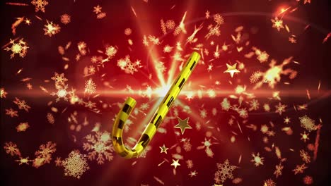 animación de estrellas doradas de navidad y bastones de caramelo cayendo sobre un fondo rojo