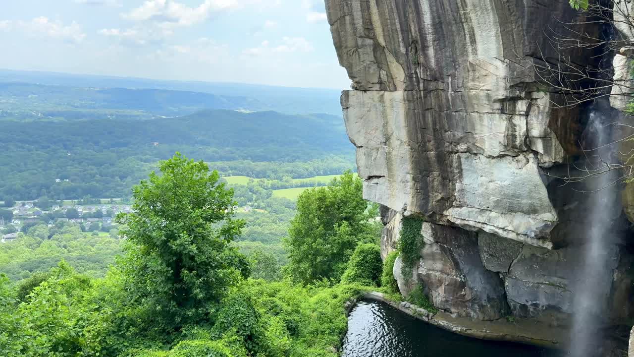 Romantic destinations - Lovers Leap waterfall at Rock City on Lookout Mountain in Georgia - panning to reveal the Appalachian mountains and countryside landscape