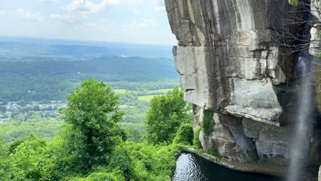 romantic destinations - lovers leap waterfall at rock city on lookout mountain in georgia - panning to reveal the appalachian mountains and countryside landscape