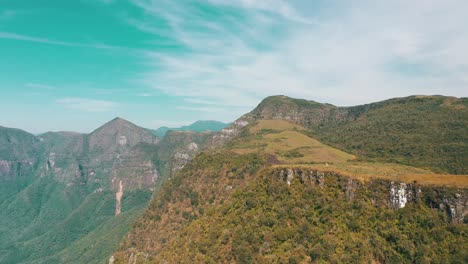 aerial cinematic establishing shot of brazilian rainforest canyon mountains and plateau