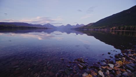 autumn scene and close up of leaves and rocks at lake mcdonald in montana