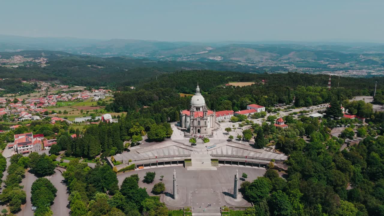 aerial - sanctuary of sameiro in braga portugal surrounded by forest and distant mountains