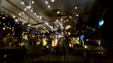 blurred image of christmas lights inside the restaurant with heater on a cold night