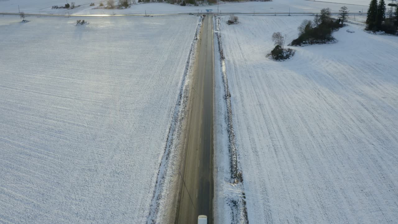 Frozen winter road at sunset - aerial