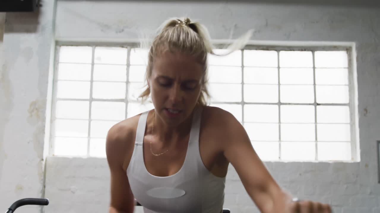 Front view of an athletic Caucasian woman exercising