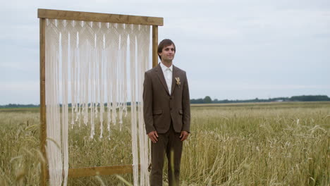 groom in an autumn field