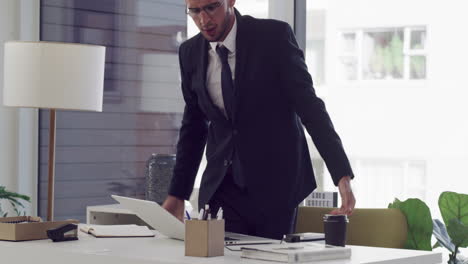 businessman stretching at workplace