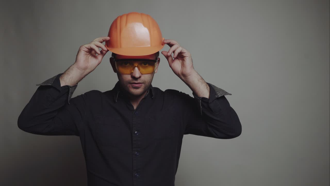 Concept of male engineer. Civil construction worker, builder, architect on gray background