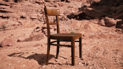 old wooden chair on rocks of grand canyon