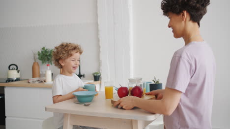 mother and son enjoying breakfast