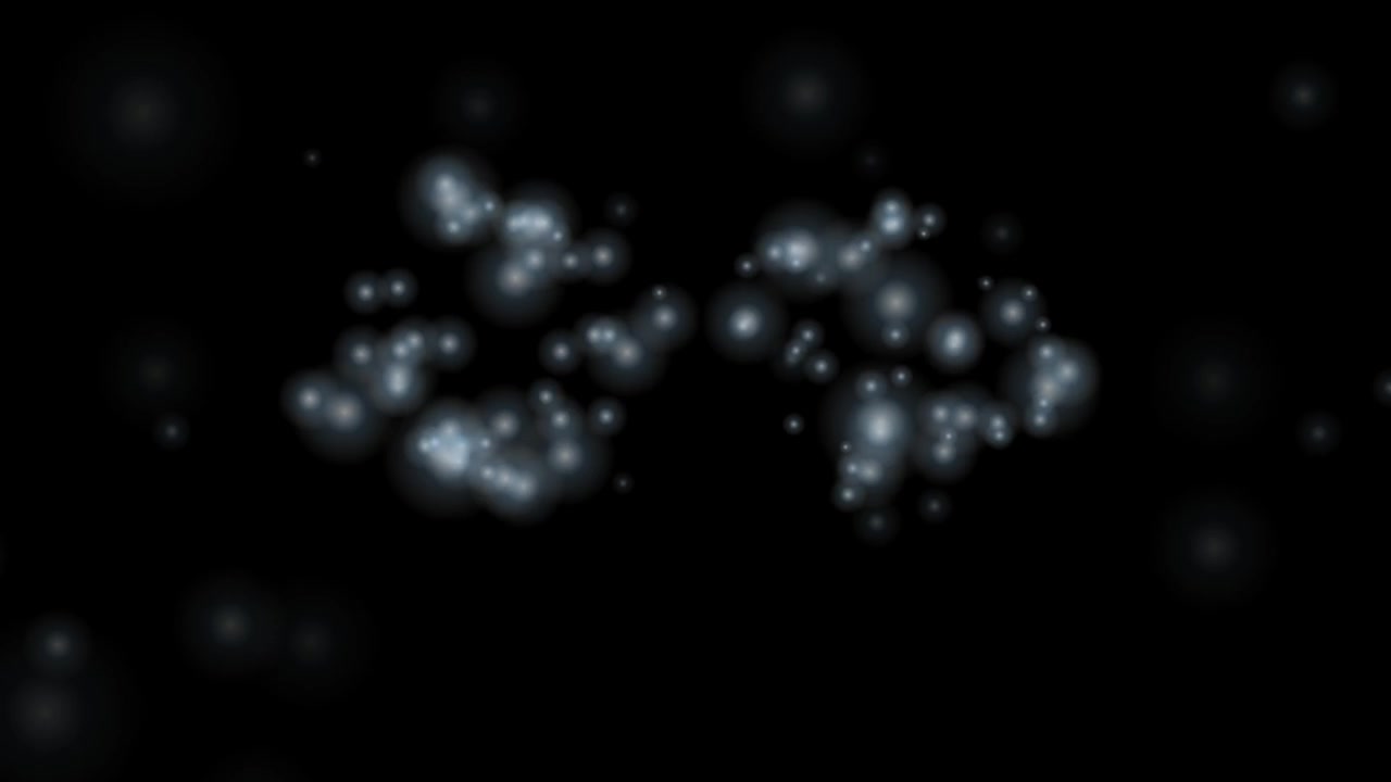 Abstract Glowing Particles Floating on Black Background