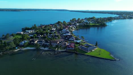 drone aerial pan landscape of toukley suburban area residential housing beachcomber hotel tuggerah lakes central coast tourism travel australia