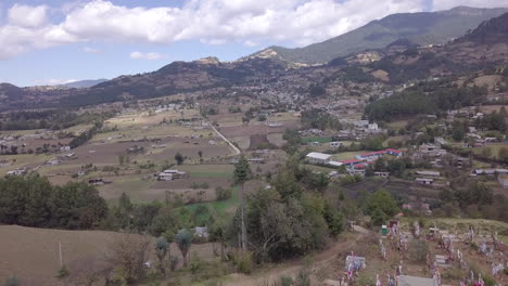 A-drone-flying-towards-the-mountains-in-Michoacán,-Mexico