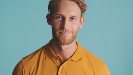 young man smiling slightly