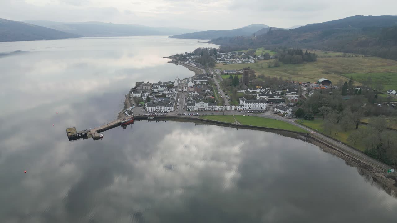 Aerial Reveal of Inveraray Village Reflected on Tranquil Loch Fyne