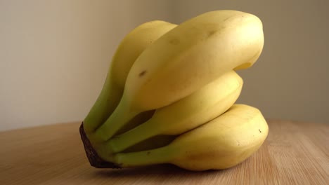 banana bunch rotating on white