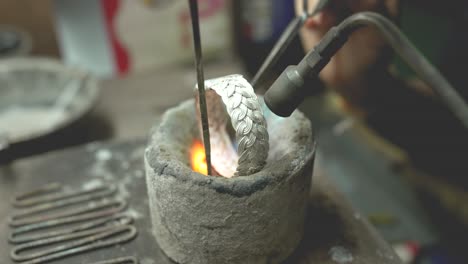 jeweler at work in jewelry. desktop for craft jewelry making with professional tools. close up view of tools. thailand.