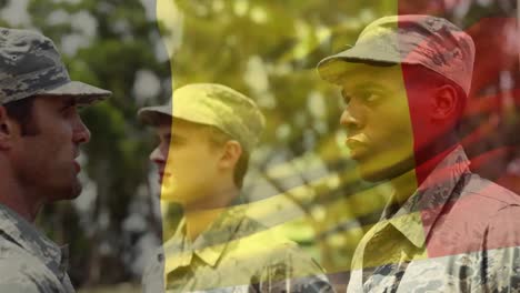 waving belgium flag against soldier saluting his army sergeant at training camp