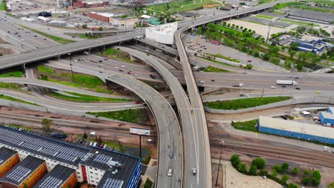 traffic driving on interstate highway road convergence near downtown denver, colorado