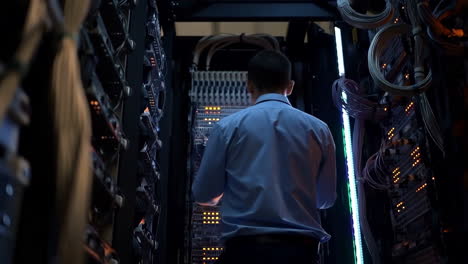 it professional walking through a data center server room