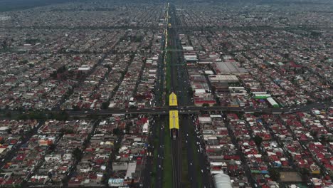 aerial view captures a metro station located on a major avenue in ecatepec, mexico