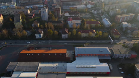 aerial view of a smaller city and its daily bustle on the streets during the golden hour