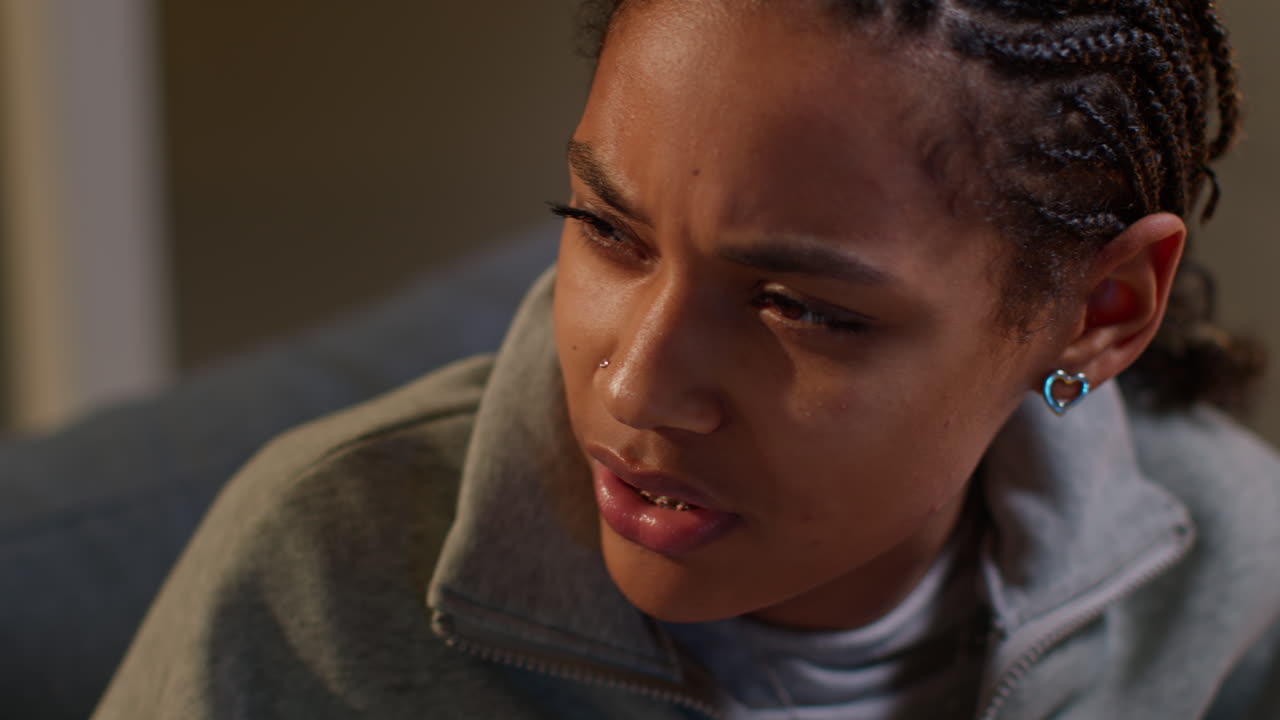 Close-up of a woman looking thoughtful and concerned