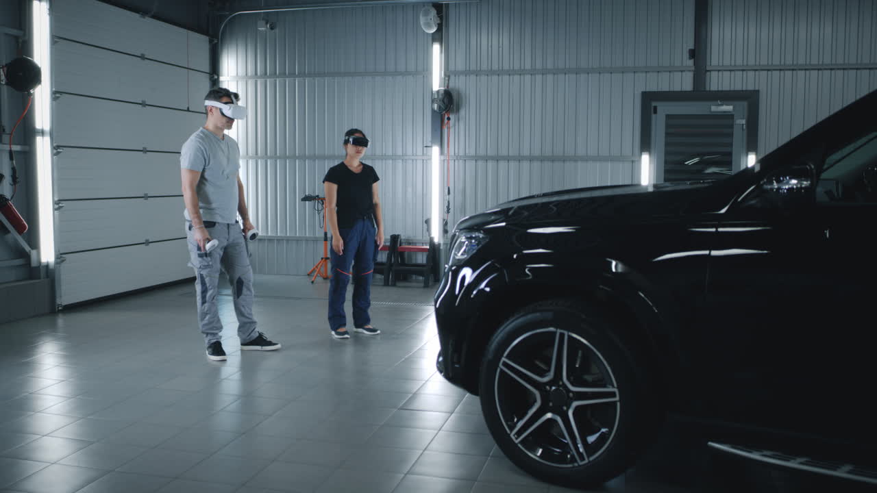 People Using VR/AR Headsets for Automotive Applications in a Service Bay