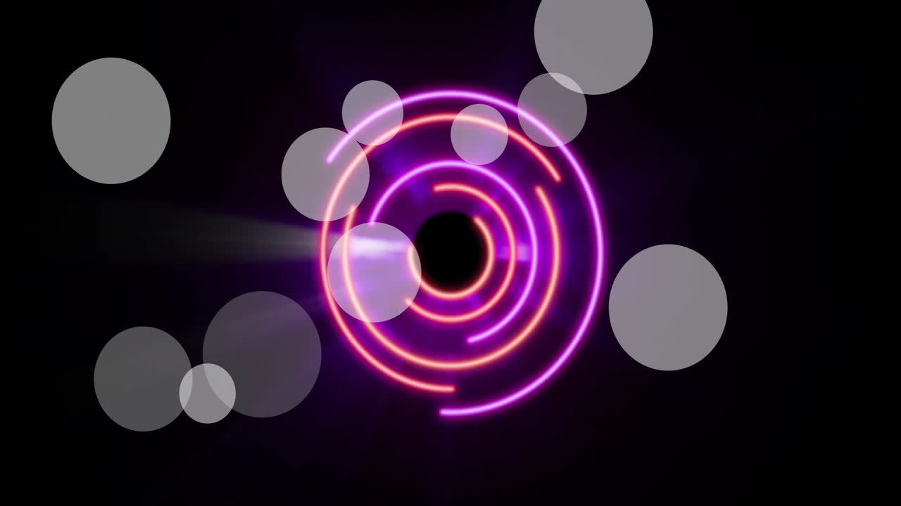 Animation of light spots over neon circles on black background